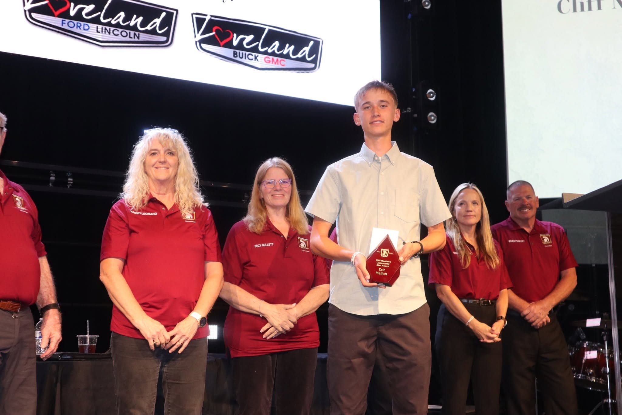 Hall of Fame committee members in branded Berthoud polos on stage