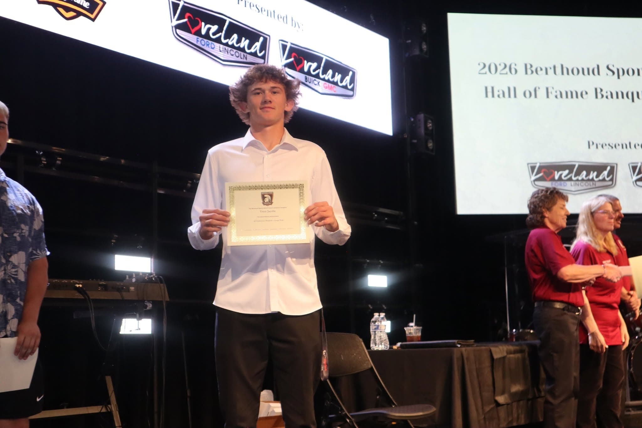 Award recipient proudly displays Hall of Fame certificate